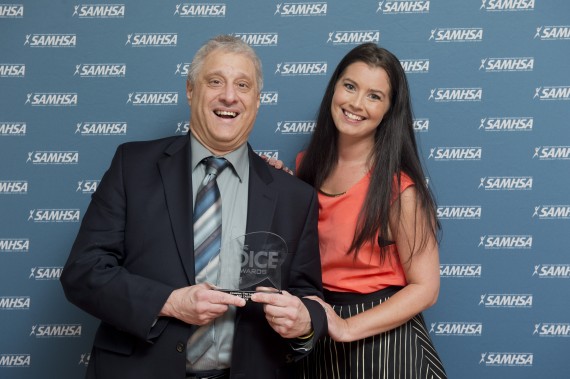 Bob Carolla receives award from Kaitlin Abell of SAMHSA