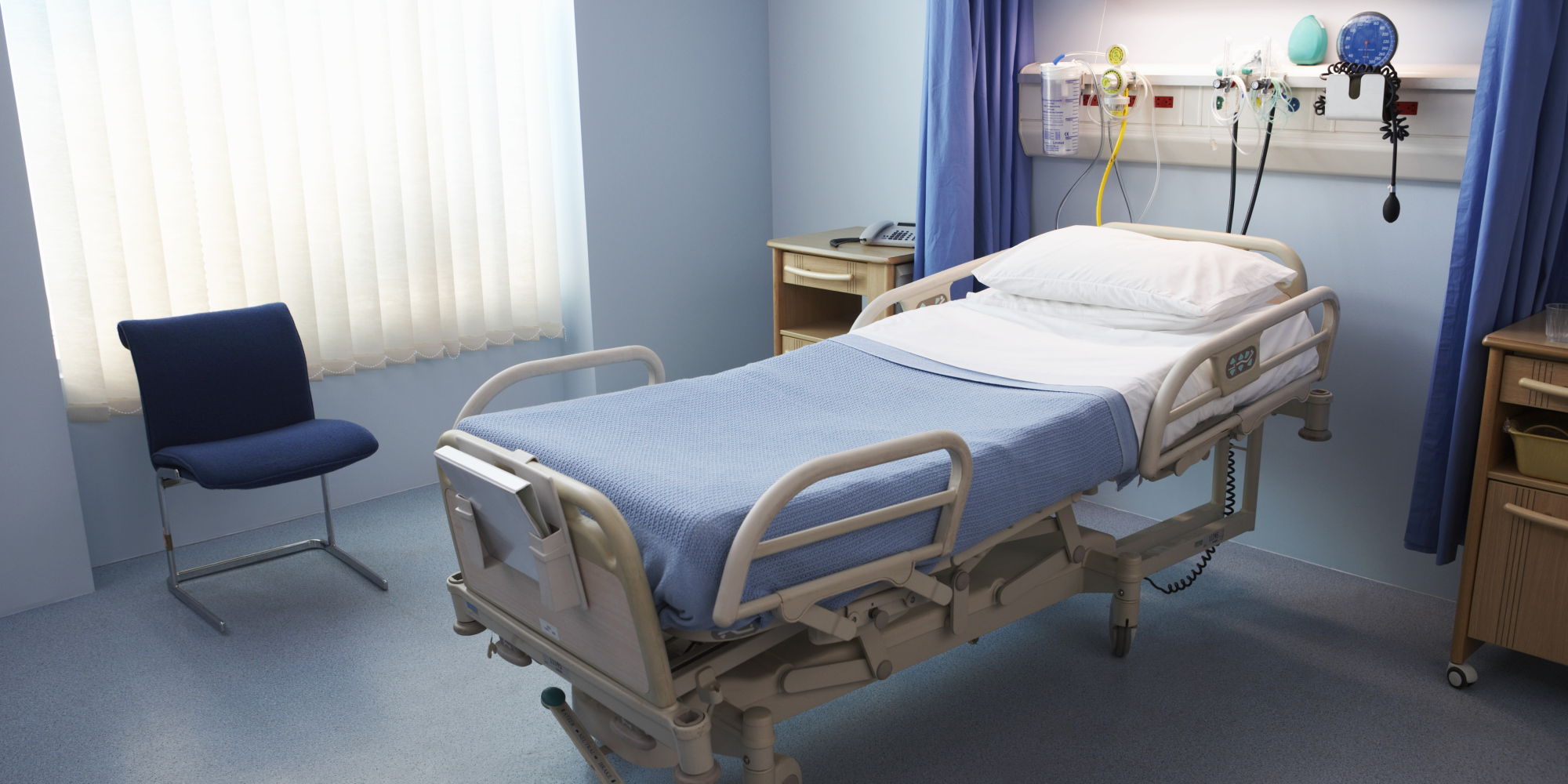 Empty Hospital Bed in a Ward